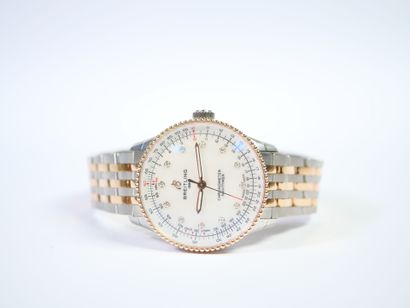 BREITLING. 
Montre-bracelet en acier et or...