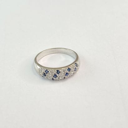 Bague or pavage pierres** dont bleues dgt...