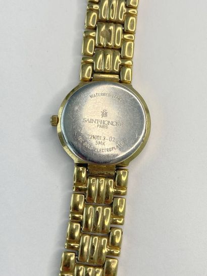 Montre bracelet de dame en métal doré St...