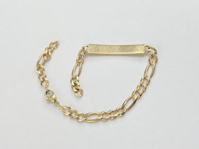 Bracelet d'identité or avec inscription cassé...