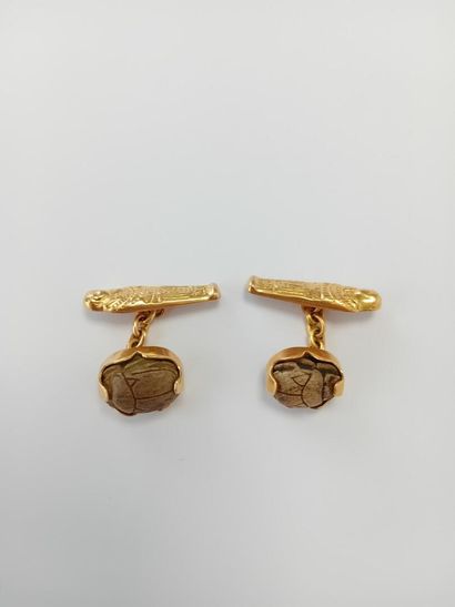 Pair of gold cufflinks with gemstones** AC...