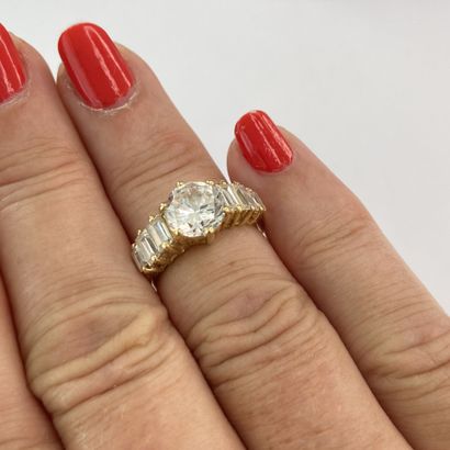 Gold ring with white stones** (round and...
