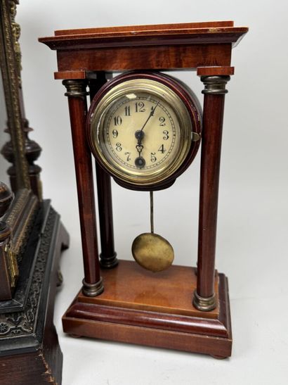 Wooden clock with chiseled brass ornamentation;...