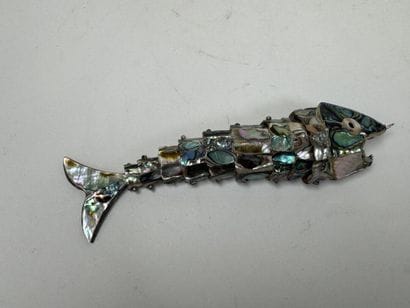 Articulated fish-shaped bottle opener made...