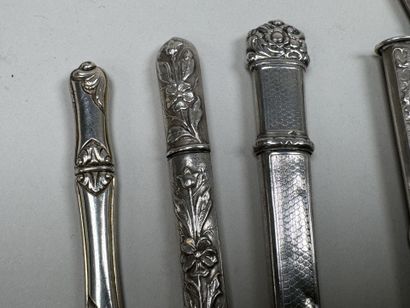 3 silver needle cases with chased and foliage...