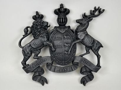 Large cast-iron coat of arms featuring the...
