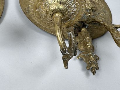 Pair of gilded bronze repoussé wall sconces...