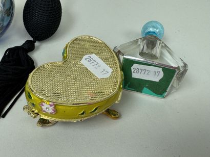 Colored glass perfume bottle and spray.
It...