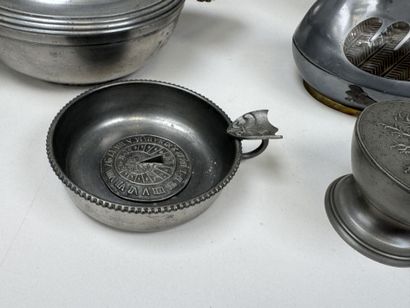 An 11-piece pewter set including a plate,...