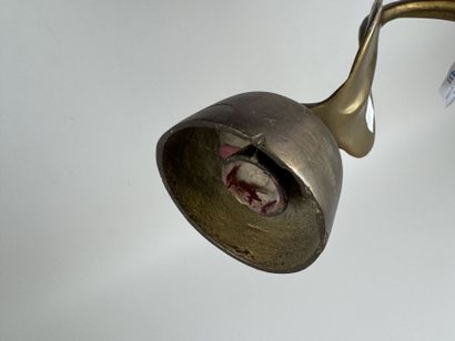 Brass wall sconce that doubles as a candleholder,...