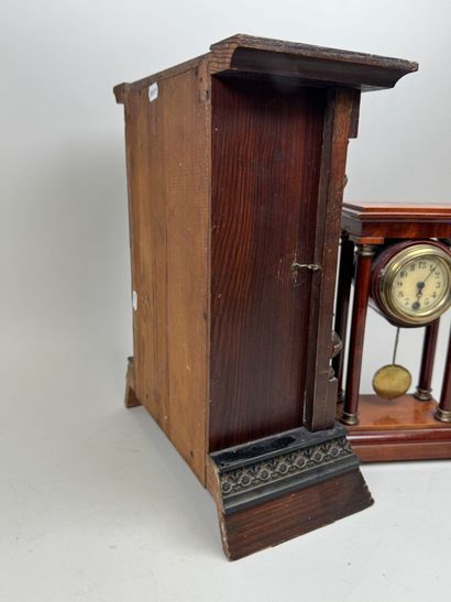 Wooden clock with chiseled brass ornamentation;...