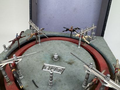 Horse race.
Circular mechanical toy with...