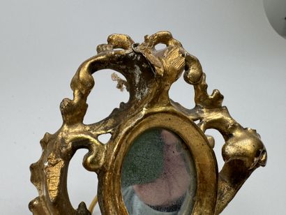 Small circular mirror made of gilded, openwork...