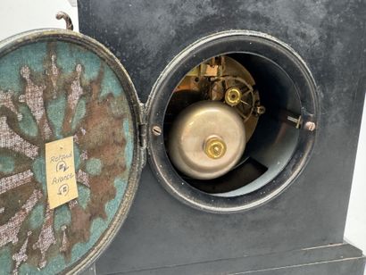 Black marble clock with a circular dial featuring...