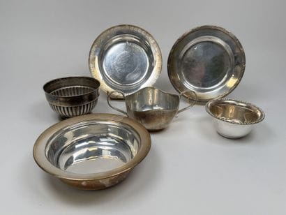 Silver plated metal set including:
- two...