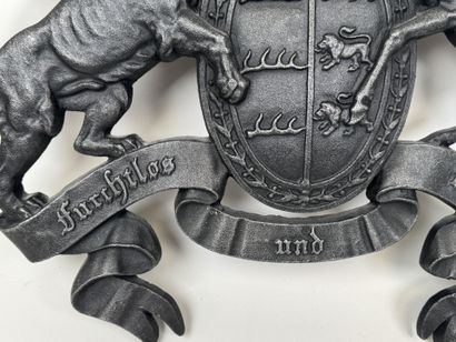 Large cast-iron coat of arms featuring the...