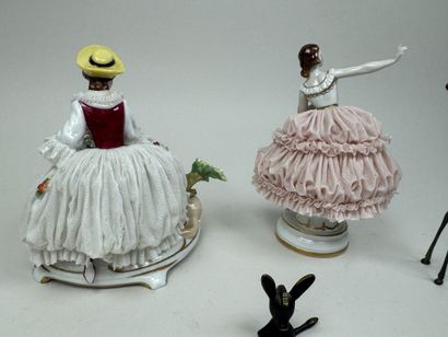 Two polychrome porcelain and gold figurines...