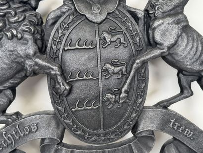 Large cast-iron coat of arms featuring the...