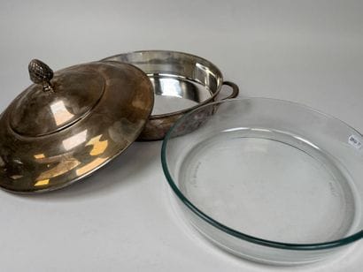A large, silver plated metal-covered vegetable...