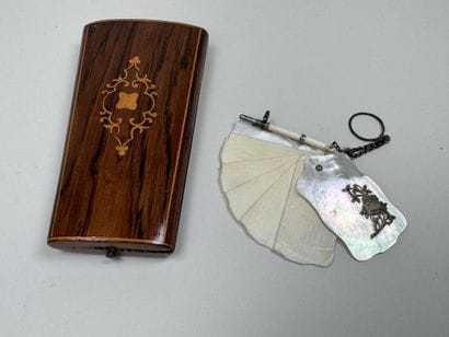 Set includes:
- a small dance card case made...