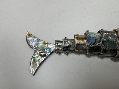 Articulated fish-shaped bottle opener made...
