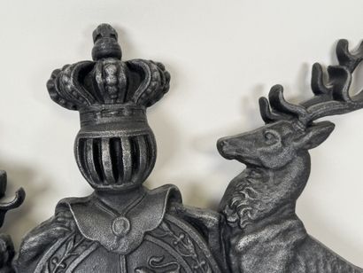 Large cast-iron coat of arms featuring the...