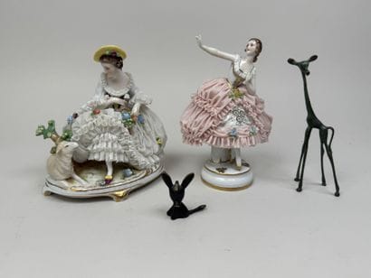 Two polychrome porcelain and gold figurines...