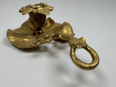 Handheld candlestick made of gilded bronze,...