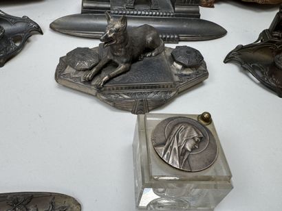 A collection of 11 desk inkwells with pen...
