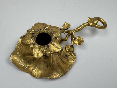 Handheld candlestick made of gilded bronze,...