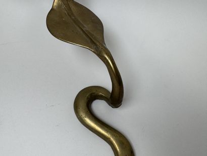 Brass wall sconce that doubles as a candleholder,...