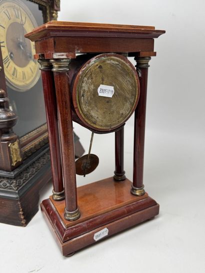 Wooden clock with chiseled brass ornamentation;...