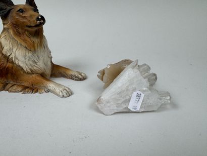 A hardstone swan resting on a piece of white...