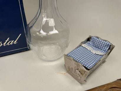 Set includes:
- A crystal or glass decanter...