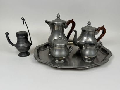 A coffee and tea service set made of pewter...