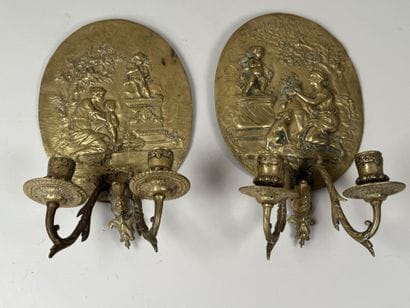 Pair of gilded bronze repoussé wall sconces...