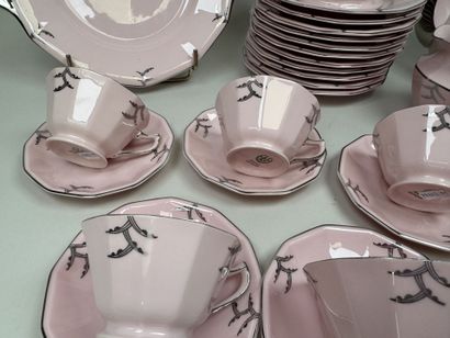 Ceramic dessert serving set on a pink background...