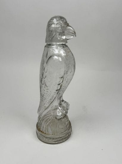 Molded glass promotional bottle featuring...