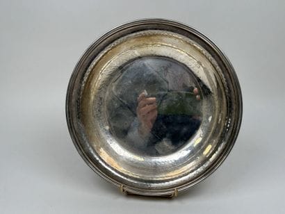 A circular, deep dish made of silver plated...