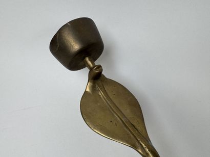 Brass wall sconce that doubles as a candleholder,...