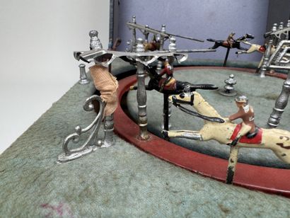 Horse race.
Circular mechanical toy with...