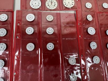 A collection of 75 enameled pocket watch...