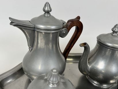 A coffee and tea service set made of pewter...