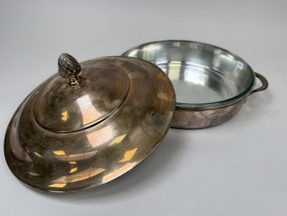 A large, silver plated metal-covered vegetable...
