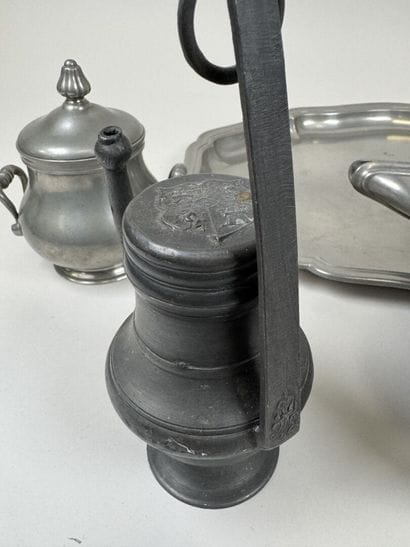 A coffee and tea service set made of pewter...