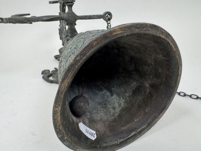 Bell and stand made of patinated bronze,...