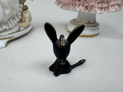 Two polychrome porcelain and gold figurines...