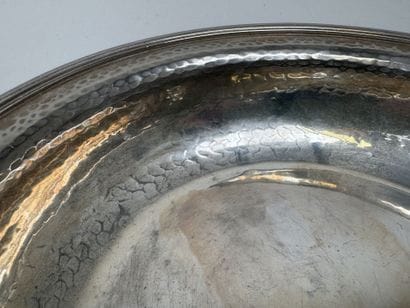 A circular, deep dish made of silver plated...