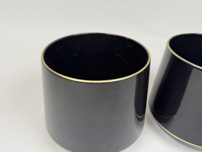 Pair of black ceramic planters with gold...