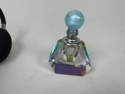 Colored glass perfume bottle and spray.
It...